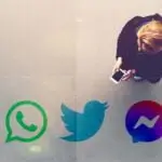 Woman using a smartphone to illustrate enhanced the passenger experience at George Best Belfast City Airport with real-time flight information updates within apps like WhatsApp, Twitter and Facebook Messenger with Airchat and Airport Hive.