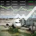 Image of aircraft docked with finance figures overlayed representing Airport Hive AMS Product category Finance